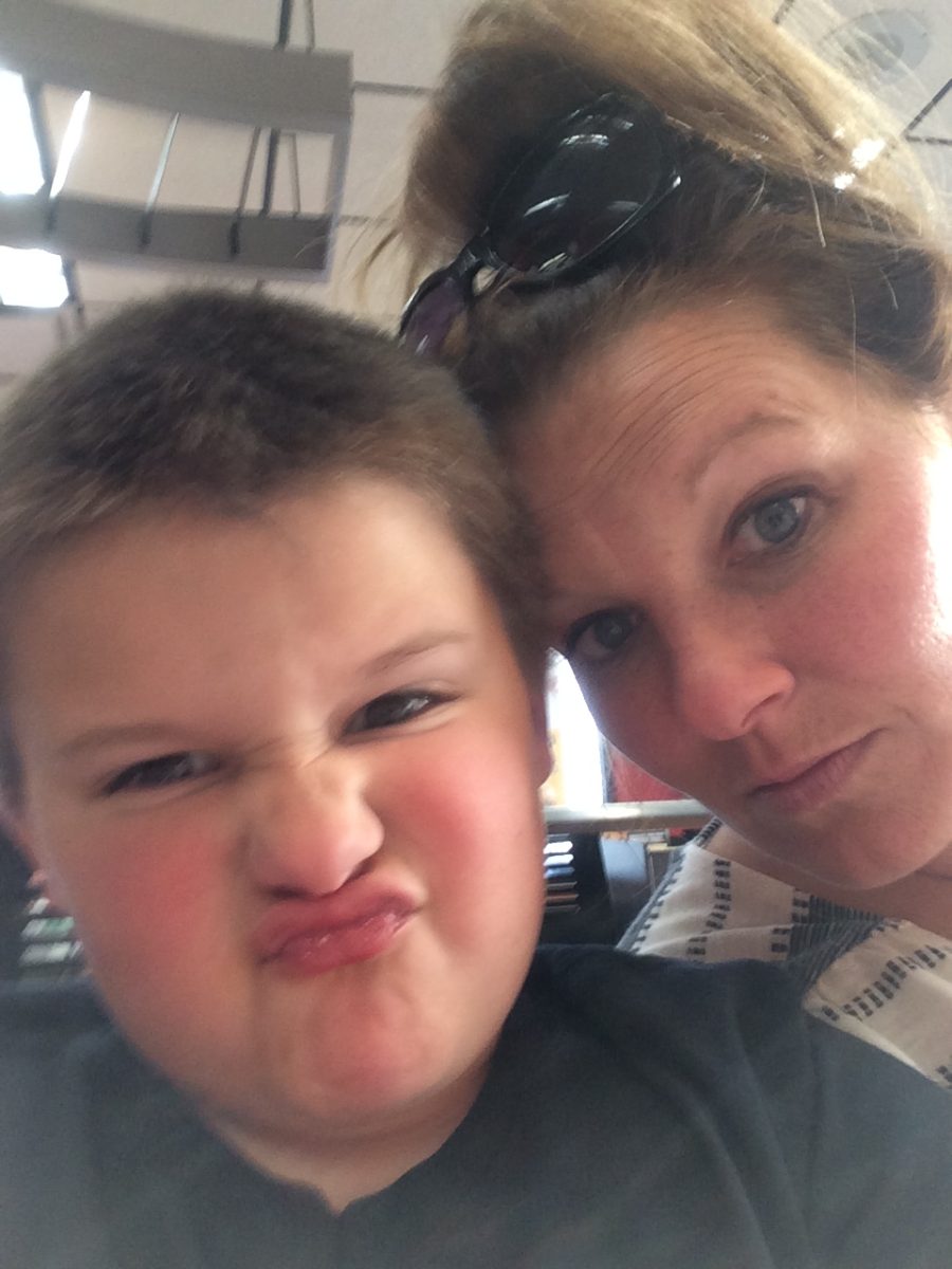 Howler Staff Writer Caiden Newlin posing with his mom, at seven years old.