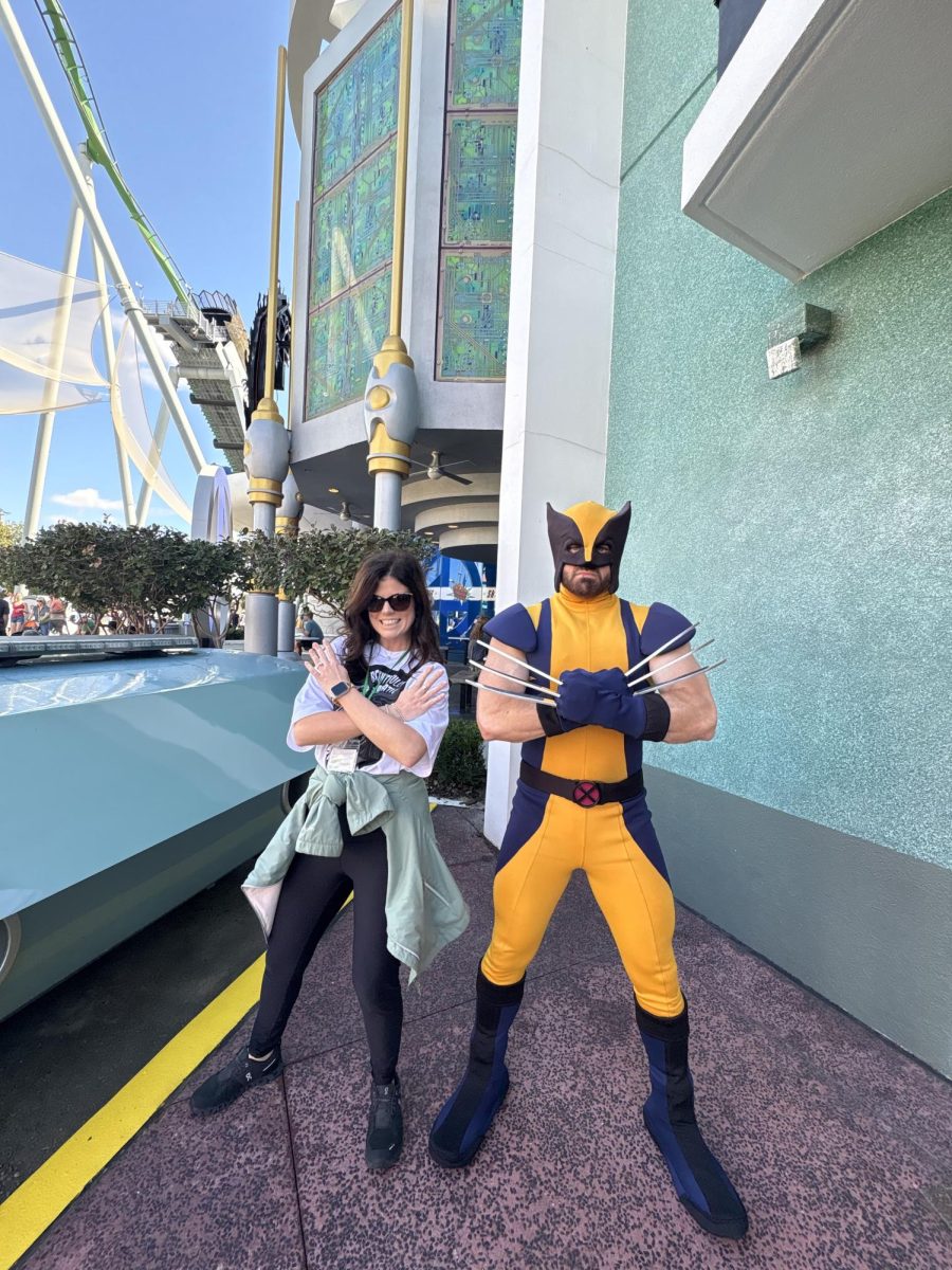 Alexander posing with Wolverine at the broadcasting Universal Studios trip.