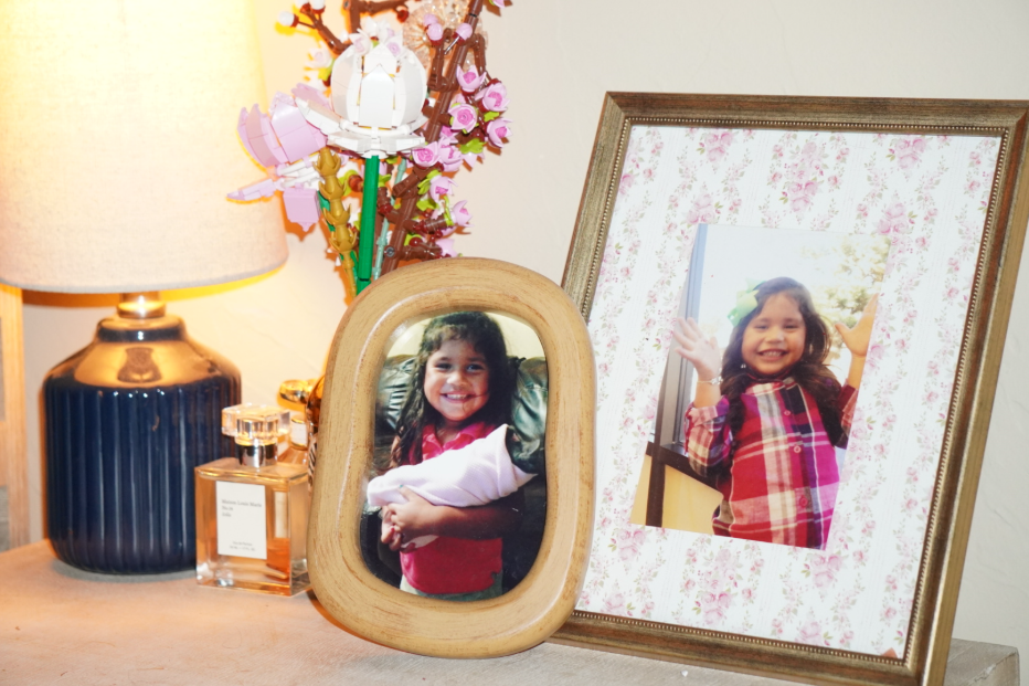 Howler Copy-Editor Emmie Vasquez's baby photos on a nightstand. 
