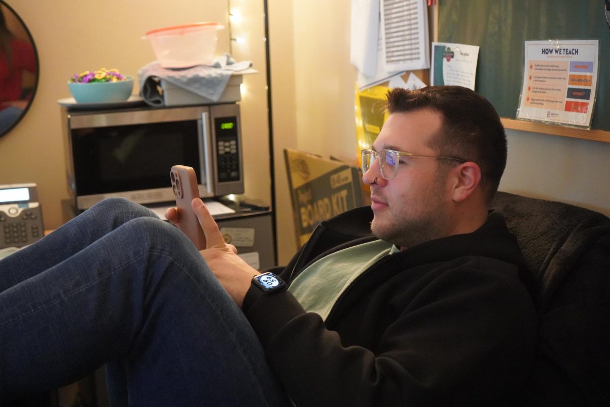Statistics teacher Nick Vincent on his phone during second hour.