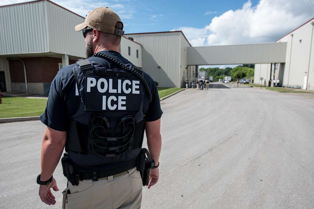 ICE Agent standing in front of Fresh Market in Salem, OH because of a criminal search warrant. They expected to find employees who violated immigration laws. 