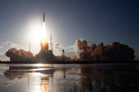 Artemis II blasting off into space.
