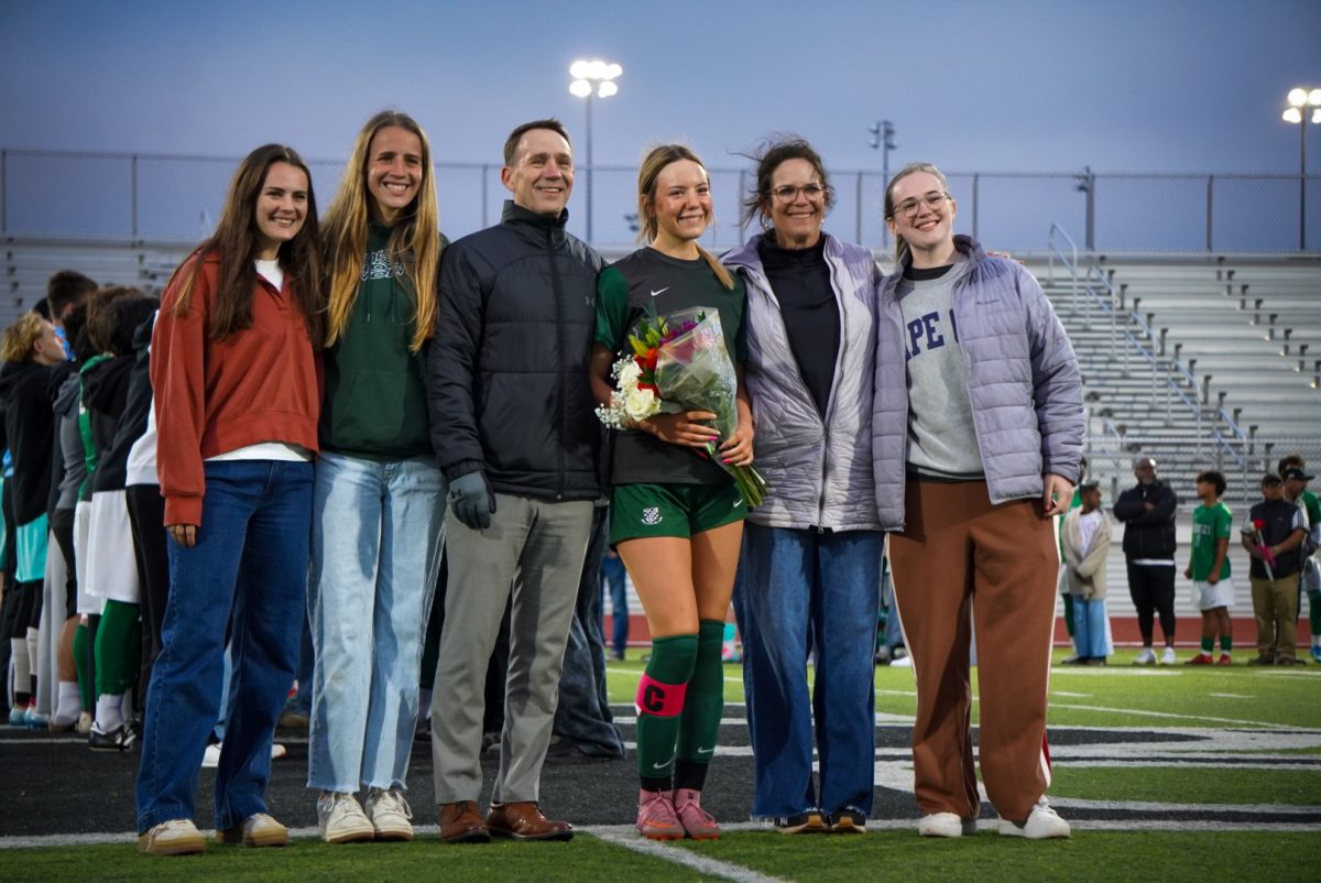 Bella Brennan being honored with her family beside her. 