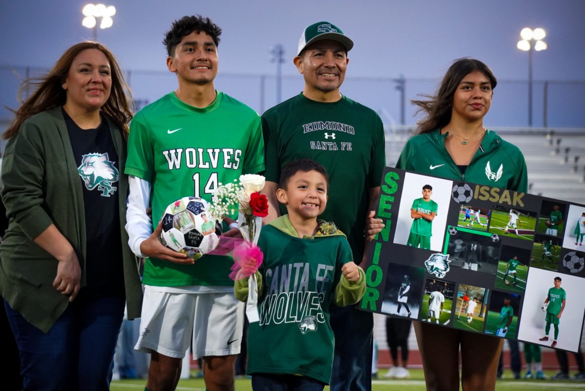 Senior Issak Hernandez with his mother, father, little brother, and sister.