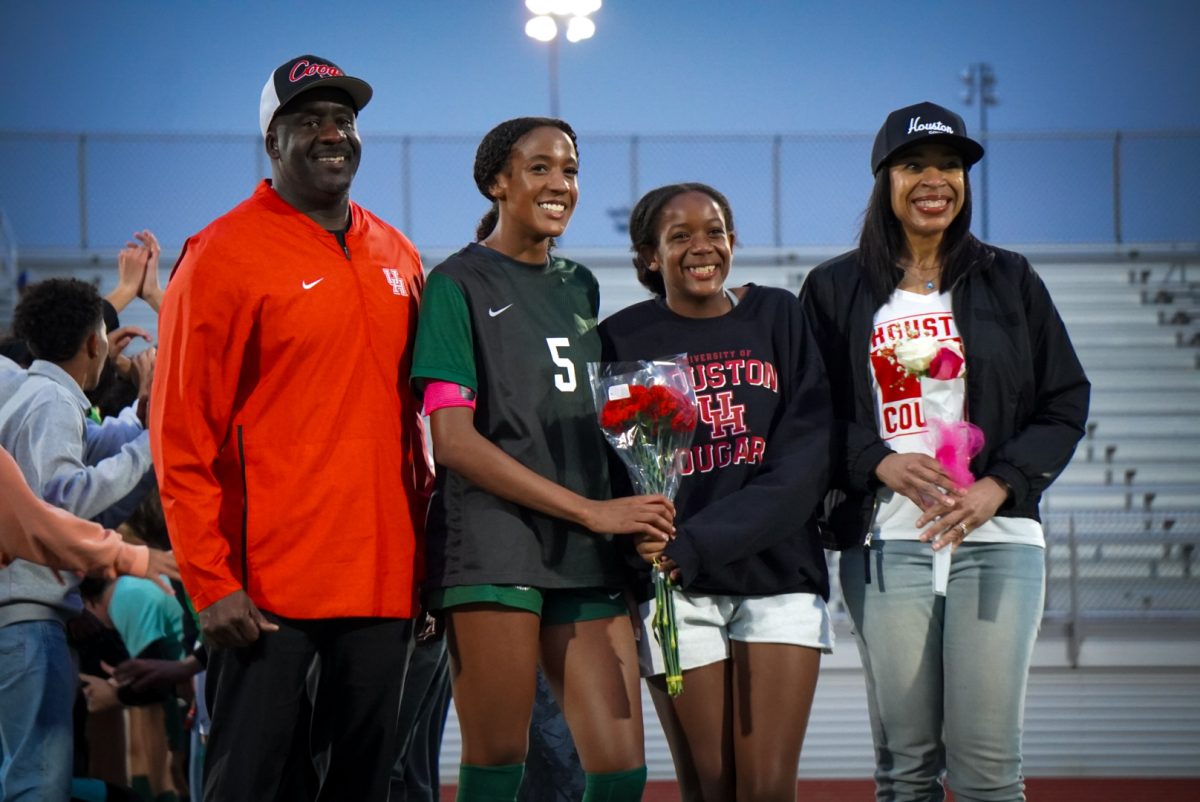 Junior Grace Whitfield accompanied by her family for senior night. 