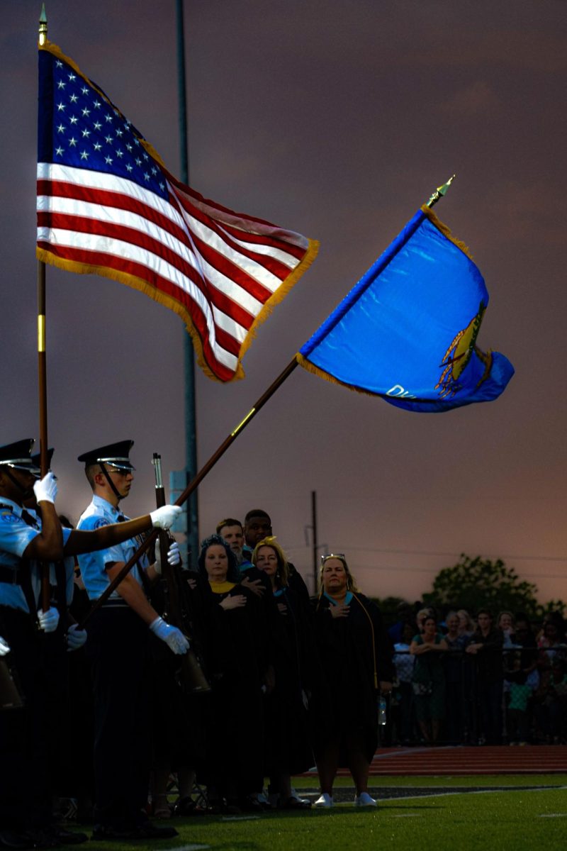 Edmond North high school's JROTC holding an American flag as well as the Oklahoma flag. 