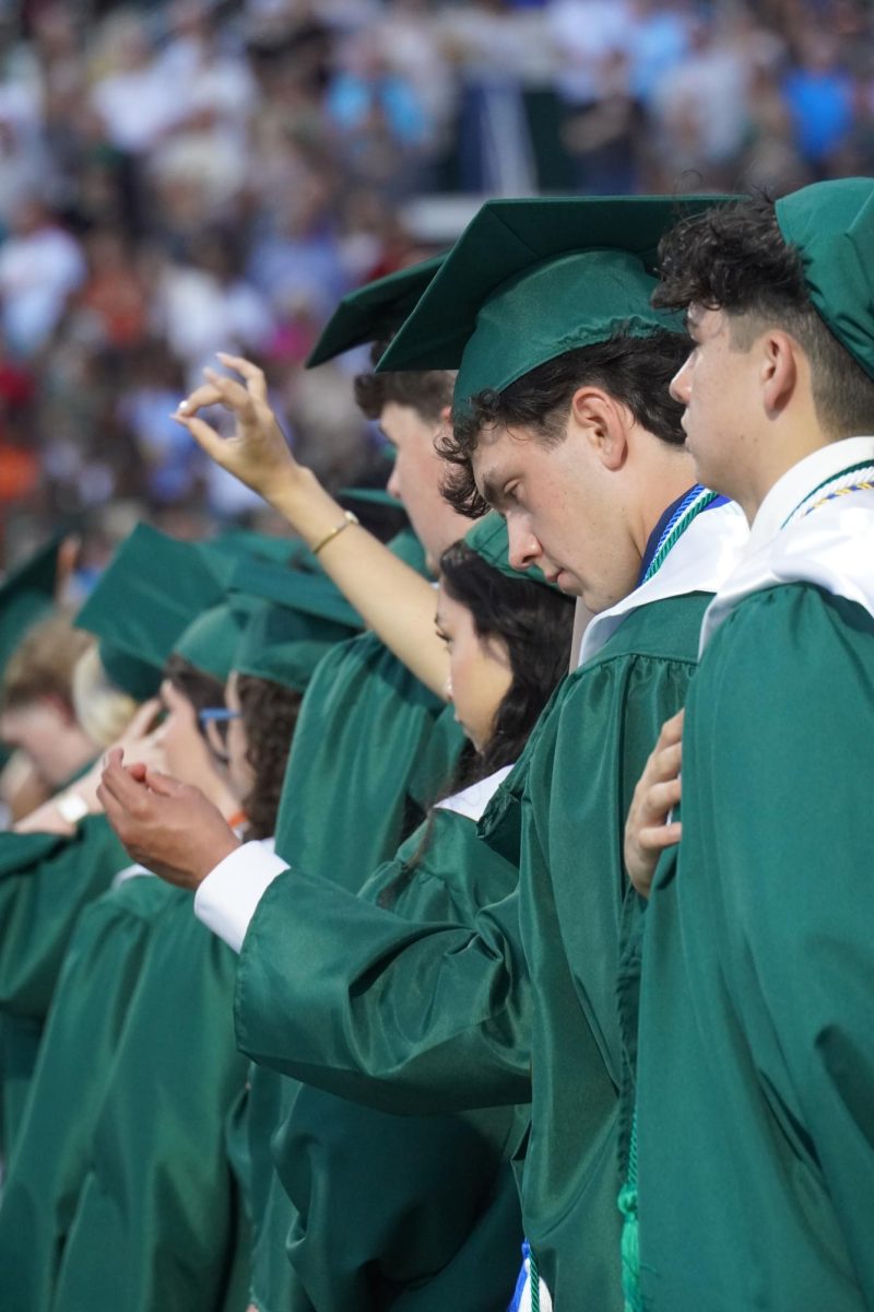Seniors pledging to Star Spangled Banner during graduation. 
